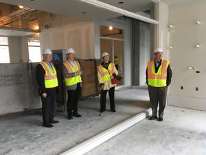 Norm and Vangie Hagfors visiting the construction site of the Hagfors Center for Science, Business, and Religion with President Paul Pribbenow and architect Bill Blanski.